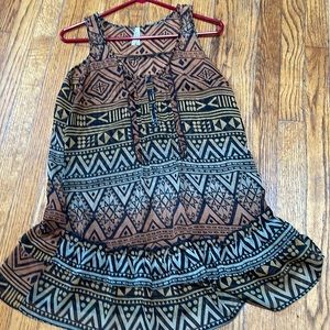 Beautiful sheer woman’s top with aztec design.